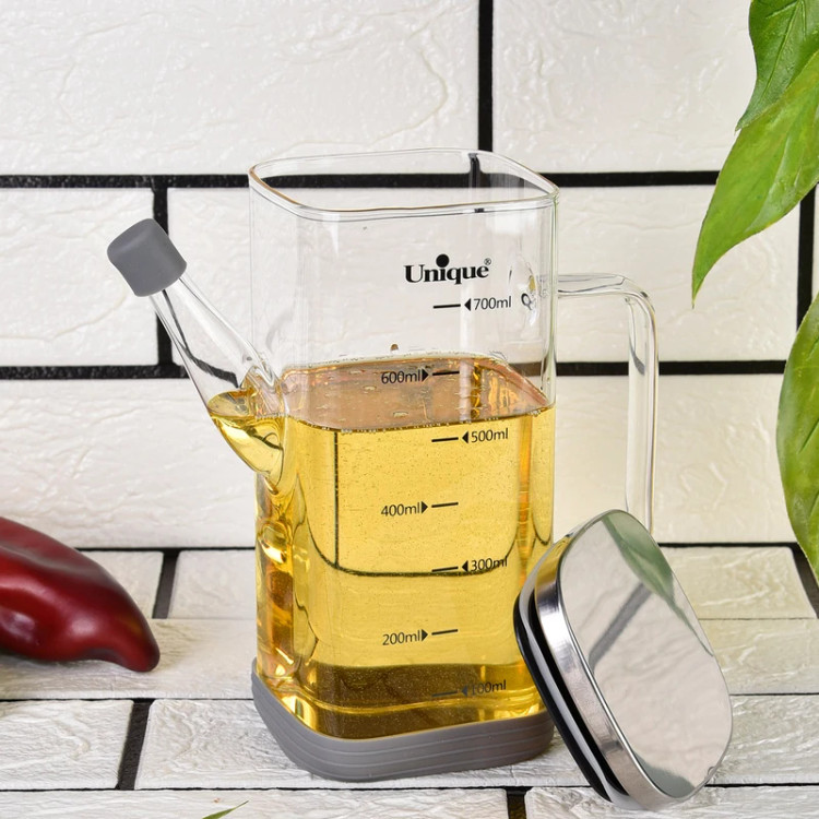 ظرف روغن پیرکس ۷۰۰ میلیلیتری یونیک پر شده با روغن مایع به همراه درب استیل